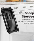 Two Pack Dog Food Storage Containers With Airtight Seal And Rolling Wheels Holds Up To 30 Lbs Each One Hand Open BPA Free Made In USA Clear And Black featuring lid with built-in scoop storage shown against a kitchen cabinet background.