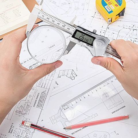Hands using 6 Inch Digital Caliper With LCD Display Stainless Steel Electronic Vernier Calipers IP54 Waterproof Switch Between Inch Metric And Fraction Your Go To Measuring Tool For DIY And Home Projects on blueprints