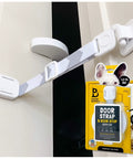 Adjustable Cat Door Latch and Stopper for Interior Hinged Doors with white strap and mounting block on door.