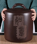 Hella Durable Ceramic Rice Jar And Airtight Storage Container For Coffee Beans Tea Flour Pet Food And Grains With Secure Lid Options, held by a person.