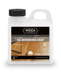 1L bottle of WOCA Oil Refreshing Soap, plant-based cleaner for wood floors, nourishing and protecting matte surfaces.