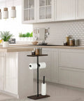 Freestanding Toilet Paper Holder With Shelf And Storage in kitchen with modern white cabinets, dispensing two rolls, storing four.