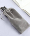Heavy Duty Handheld Single Hole Punch For Paper Card Plastic PVC And Cardstock Long Reach Pro Grade Hole Puncher in a grey pouch