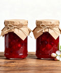 Homemade jam jars with paper covers tied using 328 Ft Jute Twine 1.5 mm 2 Ply Natural Craft Twine String, decorated with flowers.