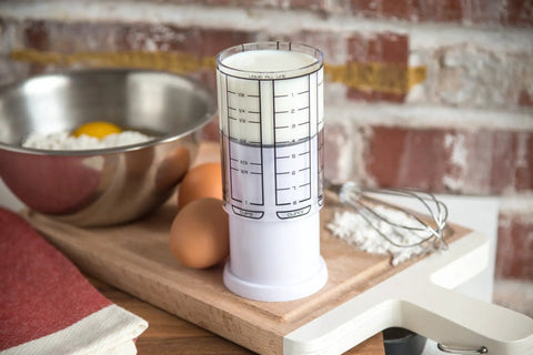 Adjustable 1 Cup Measuring Cup Made From Durable ABS And SAN Plastic With Silicone Seal, Ideal For Metric And Standard Measurements, Super Handy Kitchen Essential For Baking And Cooking Creations. on kitchen board with eggs and whisk