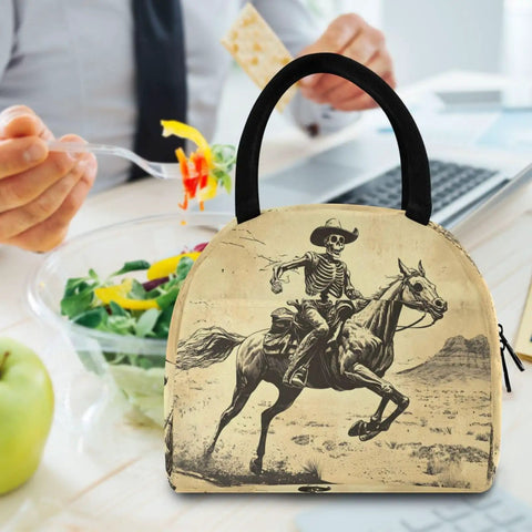 Skeleton Horse Desert Vintage Insulated Lunch Bag with cowboy print on a table with salad and laptop, easy carry handle.