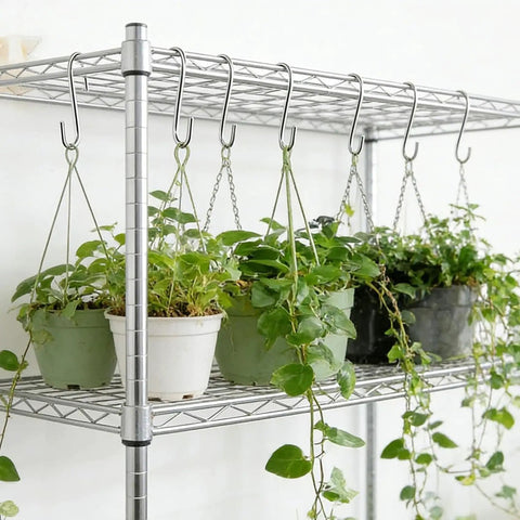 50 Pack 2.4 Inch Heavy Duty 304 Stainless Steel S Hooks For Kitchen Pots Pans Utensils Towels Tools Clothes And More No Rust Durable Hanging Hooks For Cabinets Racks Shelves displayed with hanging potted plants on a metal rack.