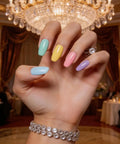 Hand with Six Candy Colors Gel Nail Polish Set HEMA Free TPO Free Soak Off Gel Polish Kit 15ml UV LED Safe in elegant setting