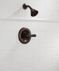 High End Lahara 14 Series Shower Trim Kit In Oil Rubbed Bronze with showerhead and control on white tile wall