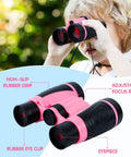 Child using pink binoculars from Girls Outdoor Explorer Kit With Bug Catcher Gear For Backyard Adventures, features non-slip grip