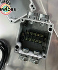 Open junction box with duplex 3/8 In wire box connector set for flex AC MC NM cables, zinc die cast screw clamp fittings visible inside.