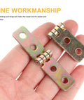 12 Pack Small Iron Chest Hinges Foldable Cabinet Door Hinges 60x13mm being held in hand, showcasing fine workmanship