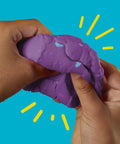 Hands squeezing vibrant purple dough from Fresh Spooky Modeling Clay 30 Pack Fun Size Sticks for creative playtime.