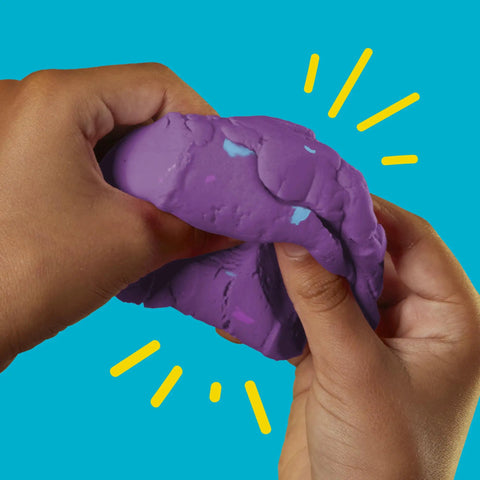 Hands squeezing vibrant purple dough from Fresh Spooky Modeling Clay 30 Pack Fun Size Sticks for creative playtime.