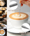 Barista Grade 12oz 350ml Milk Frother Cup With Scale In 304 Stainless Steel Pro Style Pour Spout For Latte Art And Cappuccino Easy Pour Milk Pitcher For Espresso Machines Includes Art Pen, showing latte art in a white cup, art pen in use.