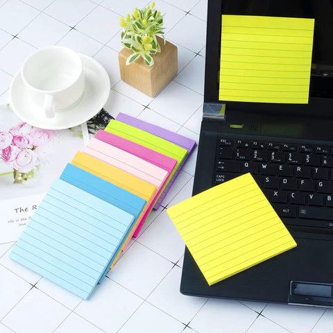 8 Pack Lined Sticky Notes 4x4 Inches Colorful Memo Pads With Super Sticky Adhesive, 8 Bright Colors For Quick Reminders, 54 Sheets Per Pad, Red Pink Orange Yellow Green Light Blue Blue Purple displayed on desk with laptop