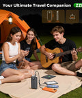 People camping using Massive 60000mAh Power Bank With 3 In 1 USB-C iOS Micro USB Cable And 22.5W Fast Charge, charging phones and tablets
