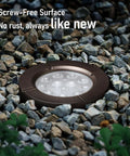 In Ground Well Lights Kit 4 Inch Flat Top, 5 Color Temperature Selectable 1800K 2700K 3500K 4000K 5000K, 12 24V AC DC, CRI90 Low Voltage Landscape Lighting, Oil Rubbed Bronze Aluminum, Pack of 6 installed among rocks