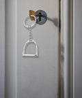 Elegant Stirrups and Snaffle Bit Key Rings D Shaped Keychain, sturdy alloy, hanging on door lock, for equestrians and horse lovers.