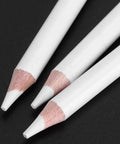 Close-up of white charcoal pencils sketching set for beginners and pros, professional drawing pencils with wooden handles.
