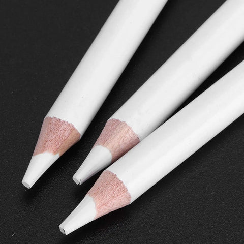 Close-up of white charcoal pencils sketching set for beginners and pros, professional drawing pencils with wooden handles.