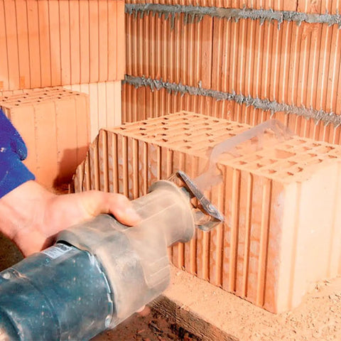 Beefy Heavy Duty Reciprocating Saw Blades Set For Demolition And Masonry Cutting brick with saw blade visible