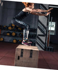 Beefy Rubber Over Center Latch With Concealed Keeper And Flexible Draw Lock attached to a wooden plyo box in a gym setting.