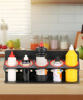 Heavy Duty Iron Wall Mount Spray Bottle Rack For Garage And Shed Storage Holds All Your Bottles Rock Solid And Totally Clutter Free For That Top Shelf Shop Vibe displaying various spray bottles on a countertop.