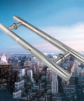Boss Brushed Stainless Steel Round Tube Door Handle Set For Glass, Wood, And Barn Doors against city skyline