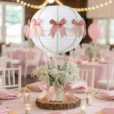 Six Pink Bow Hot Air Balloon Table Centerpieces Set With 9.8 Inch Paper Lanterns, Mini Woven Baskets, Wooden Sticks in event setting