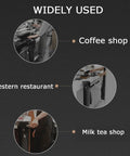 Heavy Hitter Floor Standing Coffee Knock Box With Self Draining Rubber Base Holds 6.8 Liters in a busy coffee shop setting.