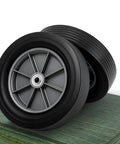 Heavy Duty 2 Pack 12 Inch Flat Free Solid Rubber Wheels 3 4 Inch Swivel Casters showing smooth, non-marking tires on a wooden surface.