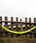 10 Ft High Visibility Chain Cover Kit In Bright Yellow For Indoor And Outdoor Barriers hanging on rustic fence