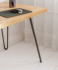 Solid Steel Hairpin Table Legs 26 Inch, 1/2 Inch Thick Black Finish, 4 Pack used on wooden desk with curtain background.