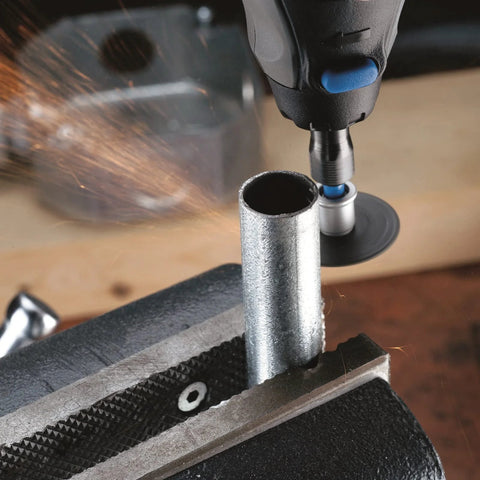 Front view of Dremel EZ-Lock rotary tool with 1.5-inch cut-off wheel cutting a metal tube in a bench vise