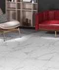 White Vinyl Peel And Stick Floor Tiles 12x12 Inch 16 Pack Waterproof Groutable Removable Floor Tiles For Renter Friendly Bathroom Kitchen Basement RV Bedroom Marble Laminate Look installed in a modern living room setting with red sofa.