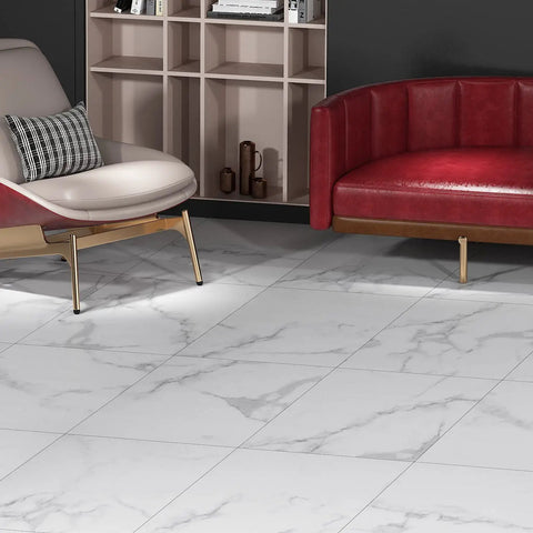 White Vinyl Peel And Stick Floor Tiles 12x12 Inch 16 Pack Waterproof Groutable Removable Floor Tiles For Renter Friendly Bathroom Kitchen Basement RV Bedroom Marble Laminate Look installed in a modern living room setting with red sofa.