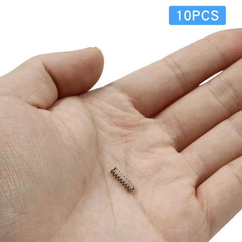 Litoexpe compression spring, 3 mm OD, 0.5 mm wire, 10 mm free length, stainless steel, silver, in palm (1 of 10)