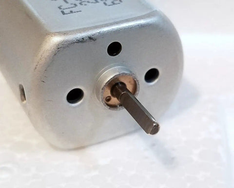 Close-up of 10Mm Flat Shaft Central Door Lock Actuator Motor with D Spindle for Power Lock Repair, OEM Replacement for 12V Door Lock Units