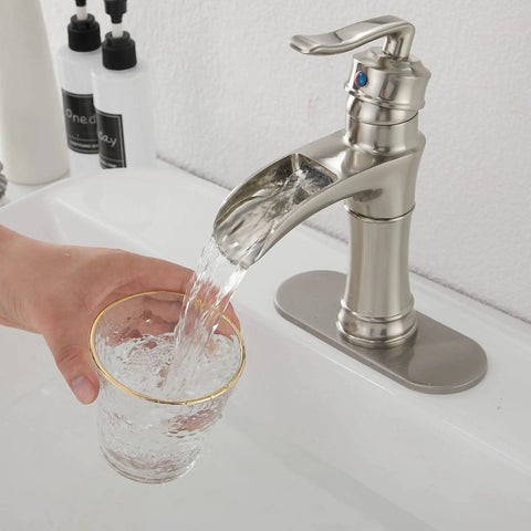 Waterfall Bathroom Faucet Brushed Nickel With Single Handle One Hole Deck Mount Vanity Tap Basin Mixer Includes Drain Assembly And Cover Plate For 1 Or 3 Hole Sinks Easy Install No Fuss with water flowing into a glass