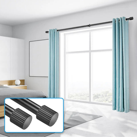 Adjustable Curtain Rod Set 1 Inch Diameter Black Metal For Windows From 16 To 92 Inches Or Up To 104 Inches Max With Cylindrical Finials Six Piece Construction For Easy Assembly In One Pack installed above window with blue curtains.