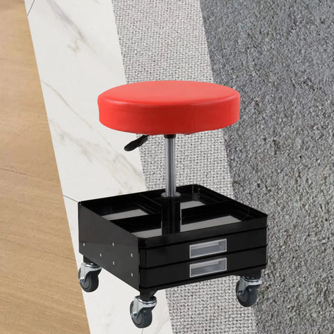 Rolling stool with red round padded seat on chrome post atop black tool cart with two drawers and four casters.