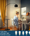 Black Floor Lamp With Marble Table Base 79 Inch Modern Industrial Arc Lamp in room with person working on laptop