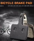 Fifteen Pair Top Shelf Bicycle Brake Pads Resin Compound Rotor Replacement For Hydraulic Disc Systems With Killer Grip Stopping Power And Ride Easy Durability, black and metallic brake pad close-up on road.