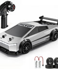 Dope 1 To 24 Scale 4WD RC Drift Pickup Car With Two Sets Of Drift And Off Road Tires High Low Speed 2 4GHz LED Remote Control Include 2 Batteries Perfect Gift For Boys And Girls Aged 6 To 16 with remote, two extra tires, and batteries.
