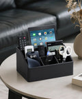 Straight Up Sturdy PU Leather Desk Organizer With Five Compartments Sleek Black Design, holding pens and remotes on a table.