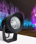 AC85‑265V IP65 Rotatable LED Flood Light (Green 25w) with a sleek design illuminating colorful trees at night.