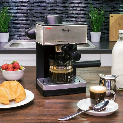 The Real Deal 4 Cup Steam Espresso System With Built In Frothing Arm For Rich Coffee And Creamy Lattes Easy Peasy Setup on kitchen counter.