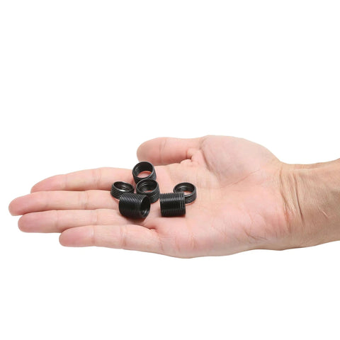 Hand holding Spark Plug Saver Inserts For Thread Repair M14 1.25 14mm Rethread Kit Fits Car Truck RV And Aircraft Garage Grade