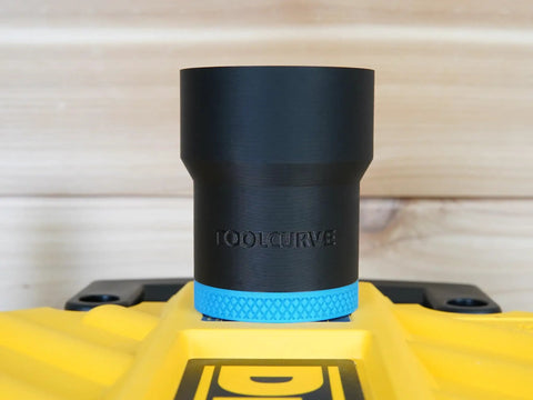 Top Shelf Dust Collection Hose Adapter Fits DW735 Series Planers, black vacuum hose adapter on yellow surface.